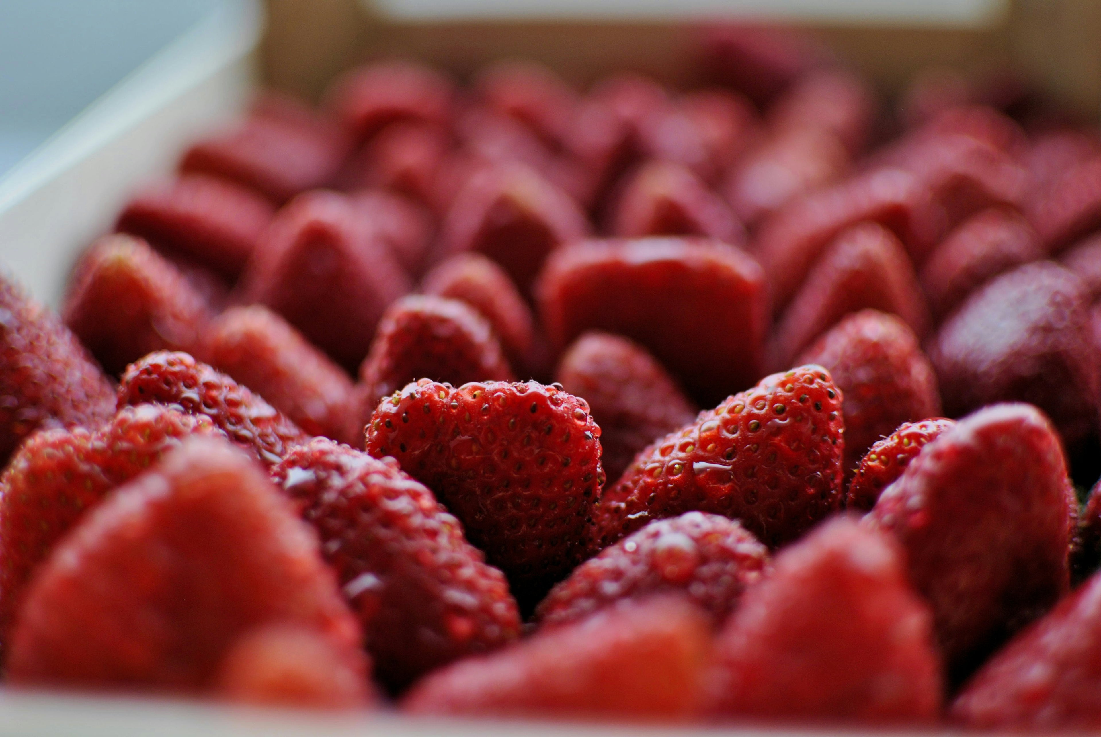 Close-up of a box filled with red strawberries